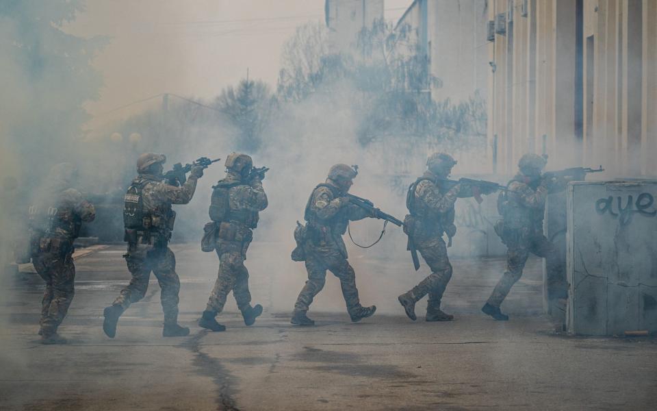 Ukrainian servicemen take part in a joint military training of armed forces, national guards, border guards and Security Service of Ukraine in Rivne region, near the border with Belarus, on February 11, 2023, amid the Russian invasion of Ukraine. (Photo by Dimitar DILKOFF / AFP) (Photo by DIMITAR DILKOFF/AFP via Getty Images) - DIMITAR DILKOFF/AFP via Getty Images