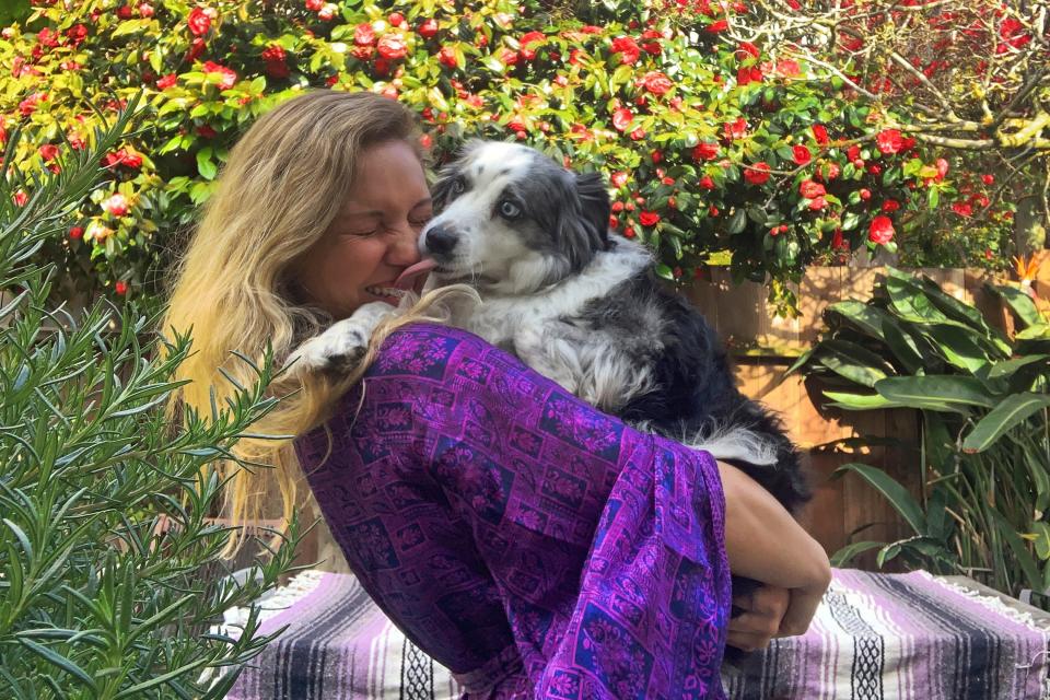 In this photo provided by Emilie Talermo, she is shown after being reunited with her six-year-old dog Jackson in San Francisco, on Tuesday, April 21, 2020.