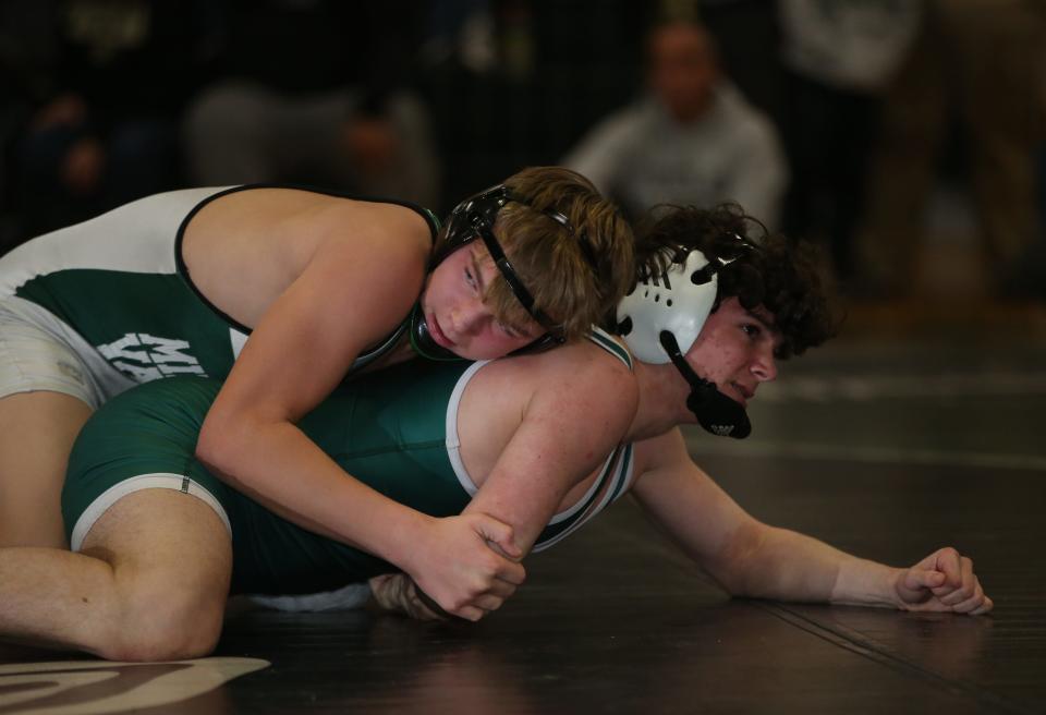 From top, Minisink Valley's Zach Filip and Cornwall's Patrick Cosgrove wrestle in the 152-pound match during the Section 9 Duals final at Minisink Valley High School on January 11, 2023.