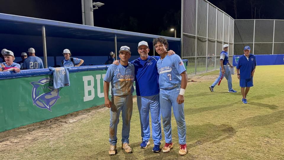 Canterbury seniors Joseph De La Nuez (left) and Evan Taveras (right) pose for a photo with Frank Turco after Turco won his 500th game on Thursday, April 11th, 2024 at Bonita Springs High School.