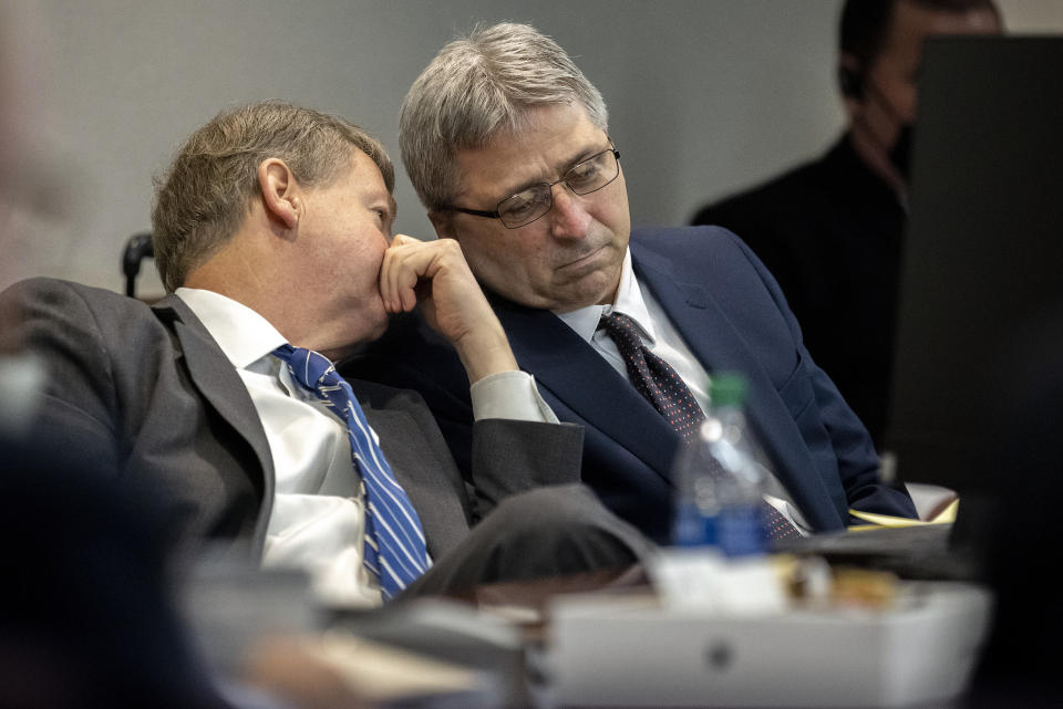 William "Roddie" Bryan, right, listens to his attorney Kevin Gough, left, during a motion hearing at the Glynn County Courthouse, Thursday, Nov. 4, 2021, in Brunswick, Ga. Bryan, Greg McMichael and his son, Travis McMichael, are charged with the February 2021 slaying of 25-year-old Ahmaud Arbery. (AP Photo/Stephen B. Morton, Pool)