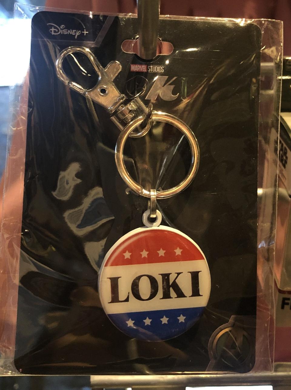 Keychain of "Loki" in the style of the classic Vote buttons