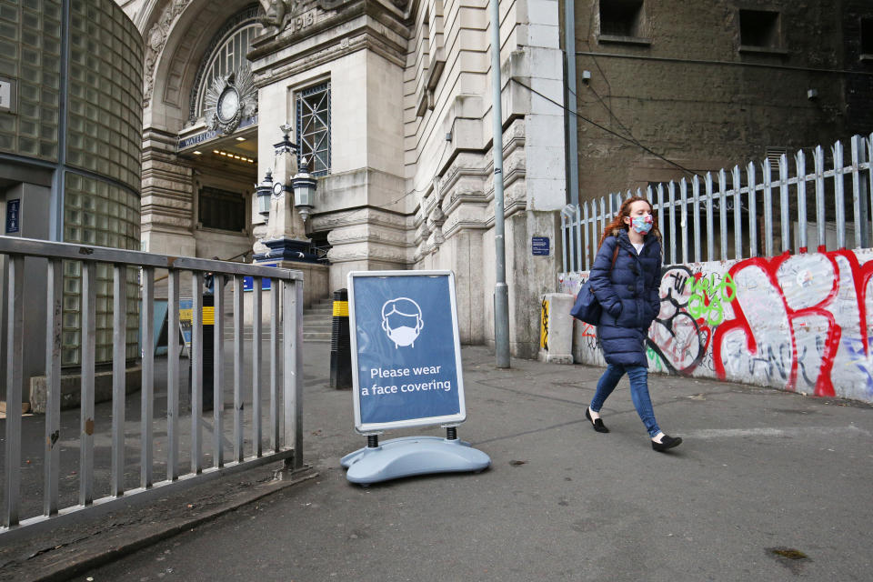 A sign asking people to use face coverings outside Waterloo station in London, following the announcement that wearing a face covering will be mandatory for passengers on public transport in England from June 15. (Photo by Jonathan Brady/PA Images via Getty Images)