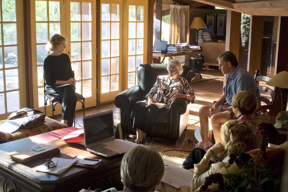 Sandra Day O'Connor (center) and her friends gather in her former home about the fate of the adobe home. The home was relocated brick by brick to Papago Park.