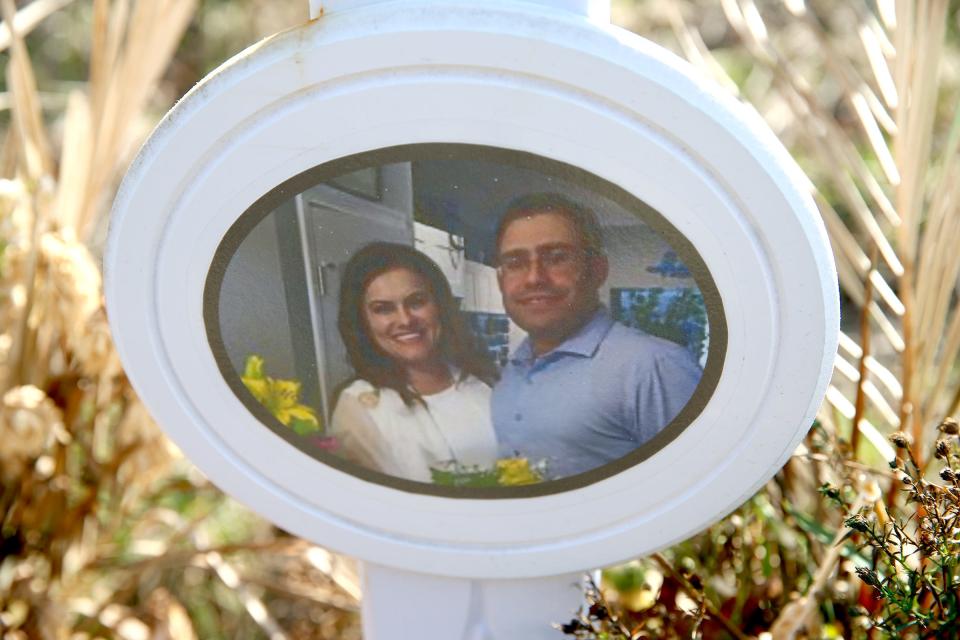 An image of Angel Acevedo and Daniela Correia Salles of Baltimore is shown on a roadside memorial along Asbury Avenue, just east of the Parkway in Tinton Falls Friday, March 18, 2022.  The Monmouth County Prosecutor has charged off duty Hillside Police Officer John P. McClave III of Toms River with being criminally responsible for their deaths in an October 2021 crash that occurred there.