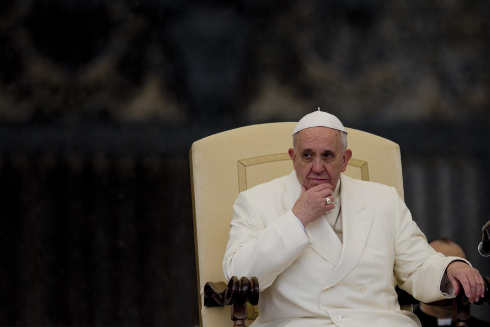 Pope Francis listens to his speech being translated in several languages, during his weekly general audience in St. Peter's Square at the Vatican, Wednesday, Feb. 5, 2014. A U.N. human rights committee denounced the Vatican on Wednesday for “systematically” adopting policies that allowed priests to rape and molest tens of thousands of children over decades, and urged it to open its files on the pedophiles and the bishops who concealed their crimes. (AP Photo/Alessandra Tarantino)