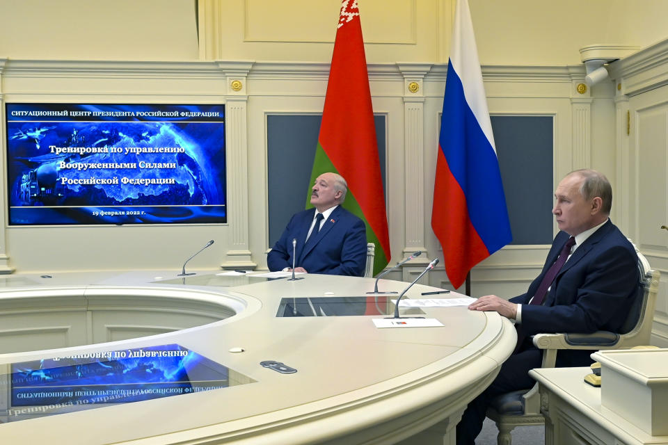FILE Russian President Vladimir Putin, right, and Belarusian President Alexander Lukashenko watch military drills via videoconference in Moscow, Russia, Saturday, Feb. 19, 2022. The Russian military on Friday announced massive drills of its strategic nuclear forces. Last year, Russia moved some of its tactical nuclear weapons into the territory of its ally Belarus that neighbors Ukraine and NATO members Poland, Latvia and Lithuania. (Alexei Nikolsky, Sputnik, Kremlin Pool Photo via AP, File)