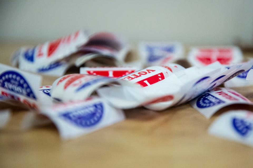 Voted stickers sit out for early voters to take after dropping off their ballot, on Tuesday, May 24, 2022, at the Polk County Election Office, in Des Moines. 