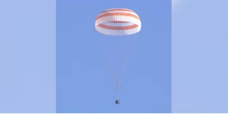 The Russian Soyuz MS-22 space capsule descends under its main parachute as it lands on the steppes of Kazakhstan on March 28, 2023.