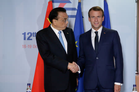 French President Emmanuel Macron meets with Chinese Prime Minister, Li Keqiang, before ASEM leaders summit in Brussels, Belgium October 18, 2018. Aris Oikonomou/Pool via REUTERS