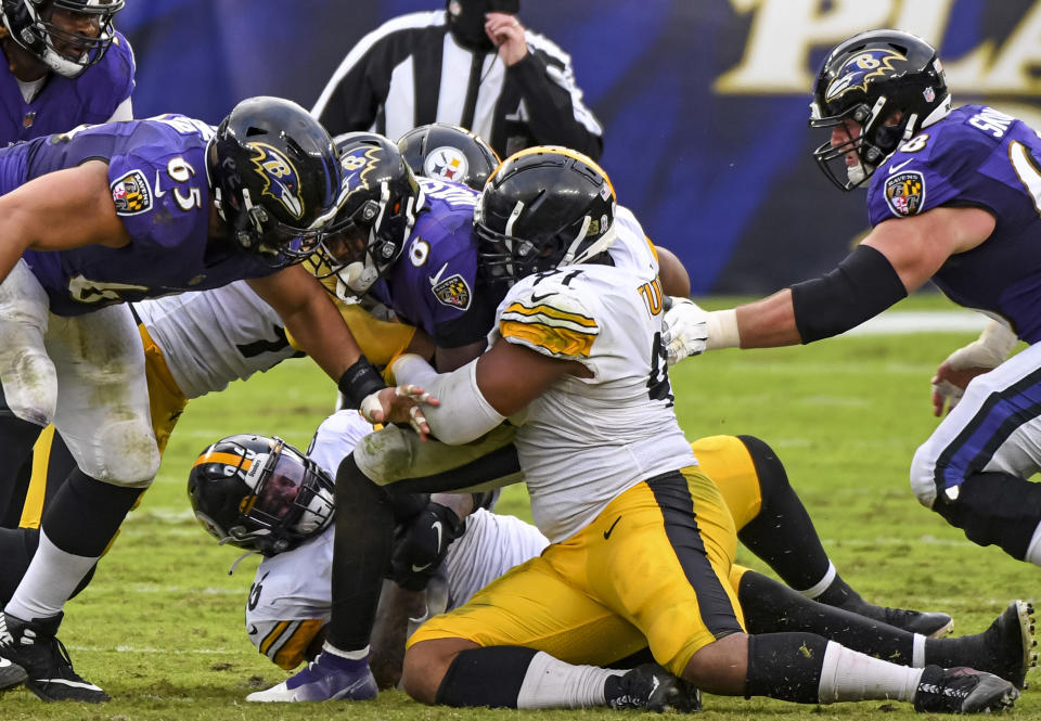 BALTIMORE, MD - NOVEMBER 01: Baltimore Ravens quarterback Lamar Jackson (8) is sacked by Pittsburgh Steelers defensive end Stephon Tuitt (91) during the Pittsburgh Steelers game versus the Baltimore Ravens on November 1, 2020 at M&T Bank Stadium in Baltimore, MD.  (Photo by Mark Goldman/Icon Sportswire via Getty Images)