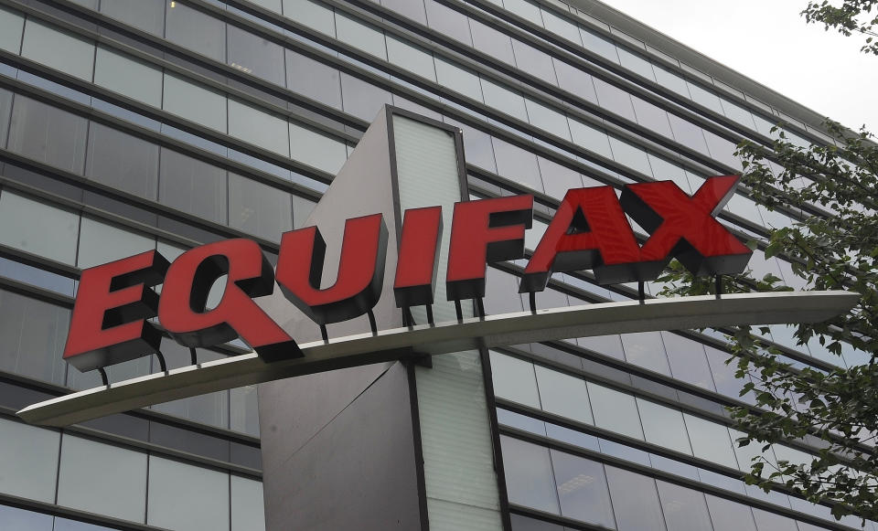 FILE- This July 21, 2012, file photo shows signage at the corporate headquarters of Equifax Inc. in Atlanta. On Wednesday, March 28, 2018, Equifax announced that Mark Begor will become its CEO as the credit reporting company continues to try to recover from fallout surrounding a massive data breach. (AP Photo/Mike Stewart, File)