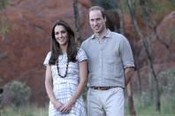 Britain's Prince William, right, and his wife Kate, the Duchess of Cambridge, pose for photos on the Kuniya walk at Uluru, Australia, Tuesday, April 22, 2014. The couple is on a three-week visit in Australia and New Zealand. (AP Photo/Rob Griffith/Pool)