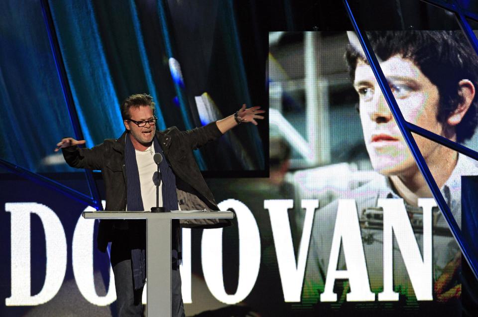 John Mellencamp introduces Donovan Leitch for induction into the Rock and Roll Hall of Fame Saturday, April 14, 2012, in Cleveland. (AP Photo/Tony Dejak)