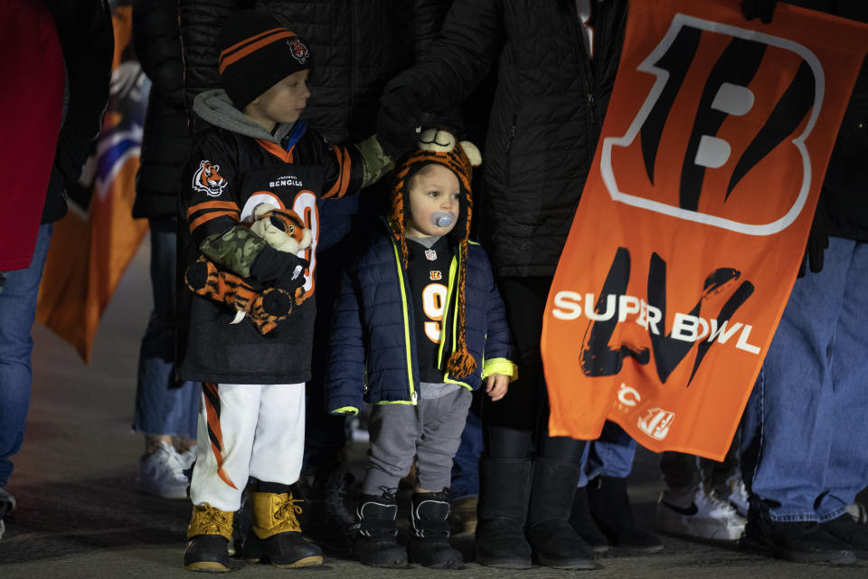 Fans wait outside Paul Brown Stadium for the arrival of the Cincinnati Bengals on Monday, Feb. 14, 2022, in Cincinnati. The Bengals were returning from their NFL football Super Bowl 56 loss to the Los Angeles Rams. (AP Photo/Jeff Dean)