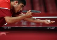 <p>USA's Kanak Jha competes aginst Russia's Kirill Skachkov during his men's singles round 2 table tennis match at the Tokyo Metropolitan Gymnasium during the Tokyo 2020 Olympic Games in Tokyo on July 26, 2021. (Photo by Anne-Christine POUJOULAT / AFP)</p> 