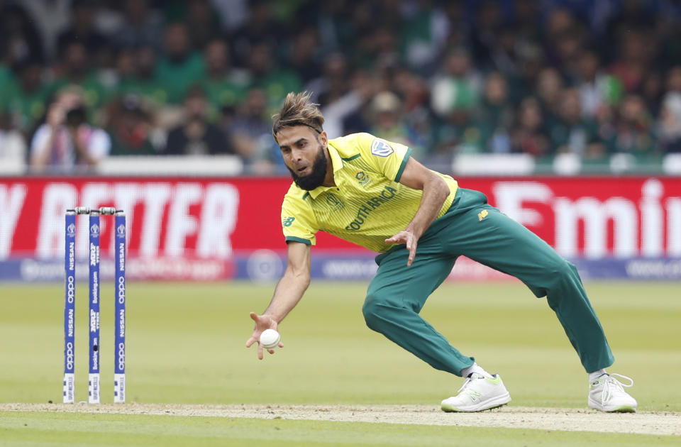 South Africa's Imran Tahir dives to his right to take the wicket of Pakistan's Imam-ul-Haq caught and bowled during their Cricket World Cup match between Pakistan and South Africa at Lord's cricket ground in London, Sunday, June 23, 2019. (AP Photo/Alastair Grant)