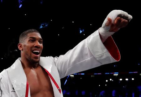 FILE PHOTO: Boxing - Anthony Joshua vs Joseph Parker - World Heavyweight Title Unification Fight - Principality Stadium, Cardiff, Britain - March 31, 2018 Anthony Joshua celebrates after winning the fight Action Images via Reuters/Andrew Couldridge