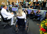 Medical Director Axel Ekkernkamp (L) and Germany's Olympic and world sprint cycling champion Kristina Vogel address a news conference for the first time since being paralysed following a serious crash in training, at the Unfallkrankenhaus hospital in Berlin, Germany, September 12, 2018. REUTERS/Fabrizio Bensch?