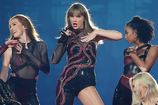 <p>Christopher Jue/TAS24/Getty Images for TAS Rights Management </p> Taylor Swift performing in the Eras Tour in February 2024 in Tokyo, Japan