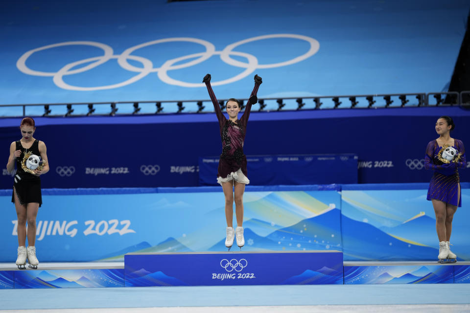 From left, silver medalist, Alexandra Trusova, of the Russian Olympic Committee, gold medalist, Anna Shcherbakova, of the Russian Olympic Committee, and bronze medalist, Kaori Sakamoto, of Japan, pose during a venue ceremony after the women's free skate program during the figure skating competition at the 2022 Winter Olympics, Thursday, Feb. 17, 2022, in Beijing. (AP Photo/Bernat Armangue)