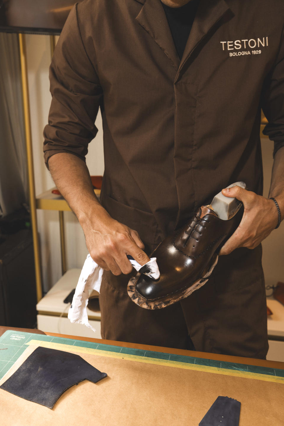 A Testoni artisan working on a made to order derby shoe.