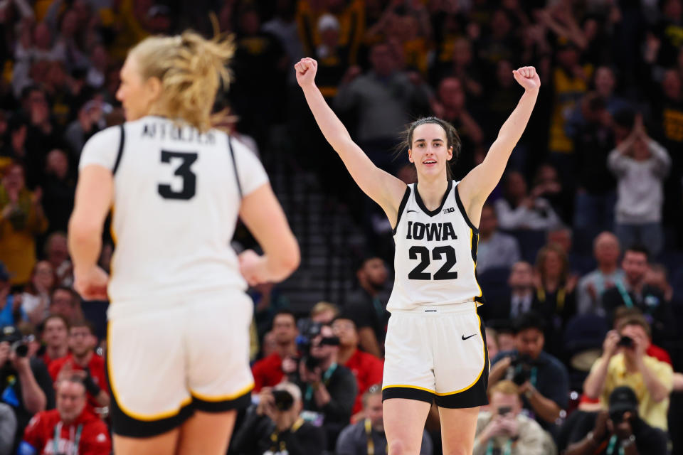 MINNEAPOLIS, MINNESOTA - MARCH 10: Caitlin Clark #22 of the Iowa Hawkeyes celebrates during overtime against the Nebraska Cornhuskers in the Big Ten Women's Basketball Tournament Championship at Target Center on March 10, 2024 in Minneapolis, Minnesota. (Photo by Adam Bettcher/Getty Images)