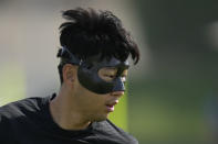 South Korea's Son Heung-min warms up during the South Korea's official training on the eve of the group H World Cup soccer match between South Korea and Ghana, at the Al Egla Training Site 5 in Doha, Qatar, Sunday, Nov. 27, 2022. (AP Photo/Lee Jin-man)