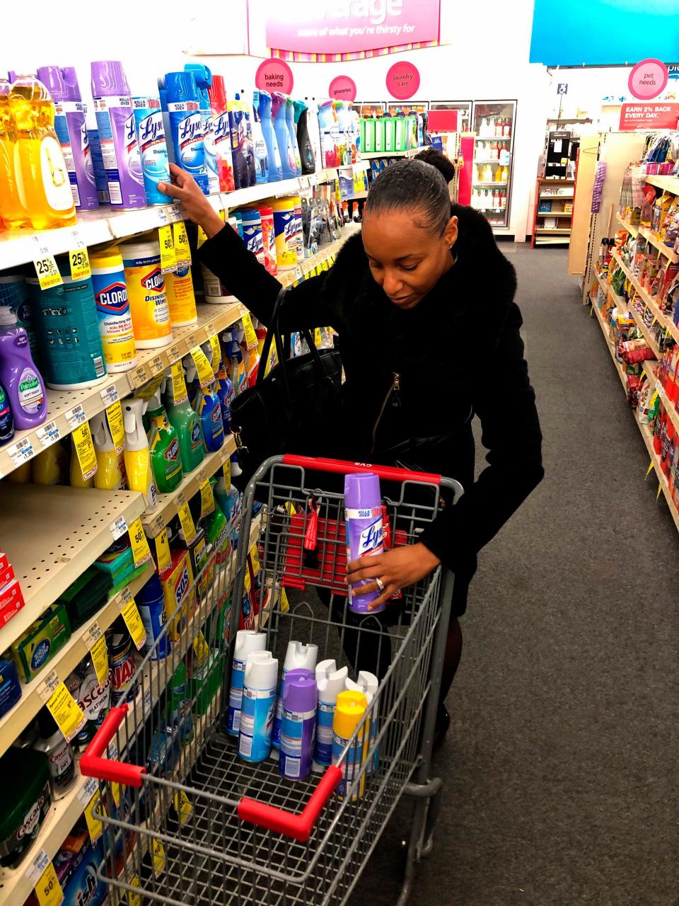 Detroit middle school principal Deborah Charaman stocks up on Lysol disinfectant spray at a CVS near downtown Detroit on March 3.