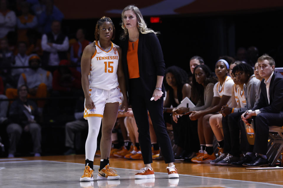 Tennessee head coach Kellie Harper, center right, talks with guard Jasmine Powell (15) during the second half of an NCAA college basketball game against Indiana, Monday, Nov. 14, 2022, in Knoxville, Tenn. (AP Photo/Wade Payne)
