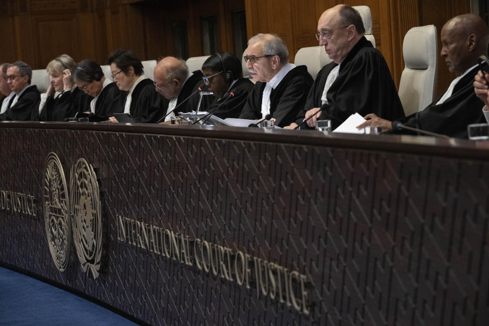 Judge Nawaf Salam, center, presides over the United Nations' highest court during historic hearings in The Hague, Netherlands, Wednesday, Feb. 21, 2024, into the legality of Israel's 57-year occupation of the West Bank and east Jerusalem, plunging the 15 international judges back into the heart of the decades-long Israeli-Palestinian conflict. Six days of hearings at the International Court of Justice, during which an unprecedented number of countries will participate in proceedings, are scheduled as Israel continues its devastating assault on Gaza. (AP Photo/Peter Dejong)