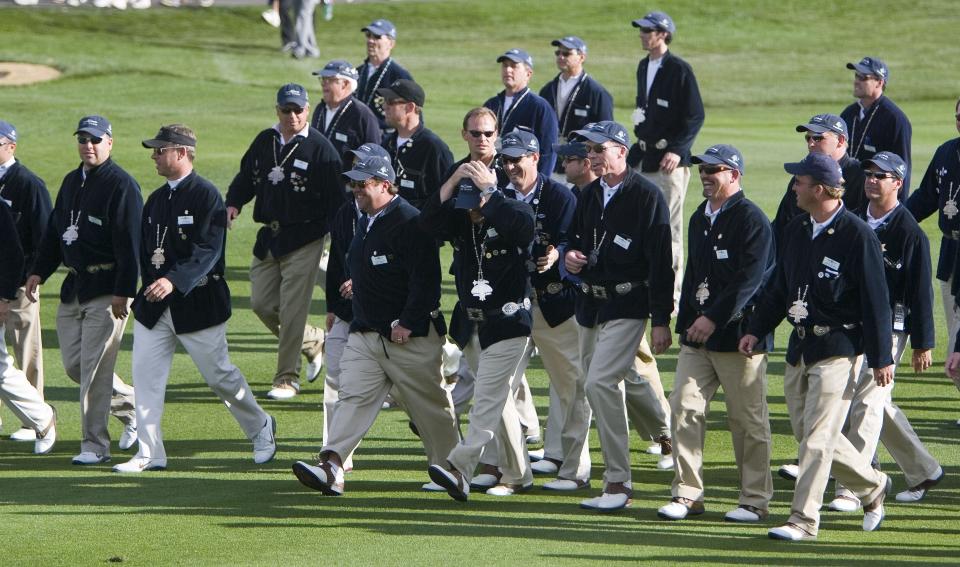 The Thunderbirds follow J.B. Holmes up the 18th fairway on day four of the FBR Open at the TPC of Scottsdale on Feb. 5, 2006. The Thunderbirds wear Indigenous-inspired pendants and belts.