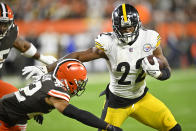 Pittsburgh Steelers running back Najee Harris, right, gets around Cleveland Browns safety Grant Delpit during the first half of an NFL football game in Cleveland, Thursday, Sept. 22, 2022. (AP Photo/David Richard)