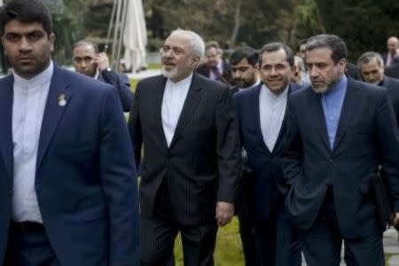 Iranian Foreign Minister Javad Zarif (C) walks with others after a meeting with US Secretary of State John Kerry and other US officials at the Beau Rivage Palace Hotel March 27, 2015 in Lausanne, Switzerland. REUTERS/Brendan Smialowski/Pool