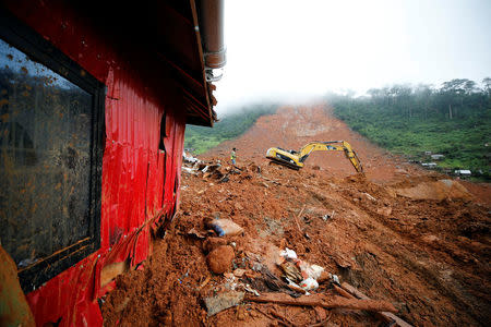 A heavy machine is seen during work at the place of the mudslide in the mountain town of Regent, Sierra Leone August 16, 2017. REUTERS/Afolabi Sotunde