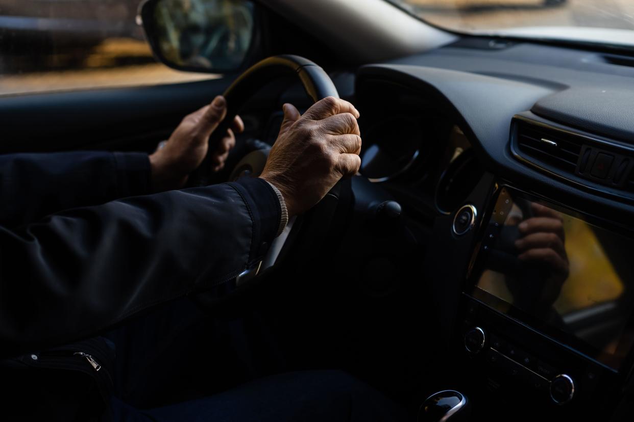 Hands on a steering wheel