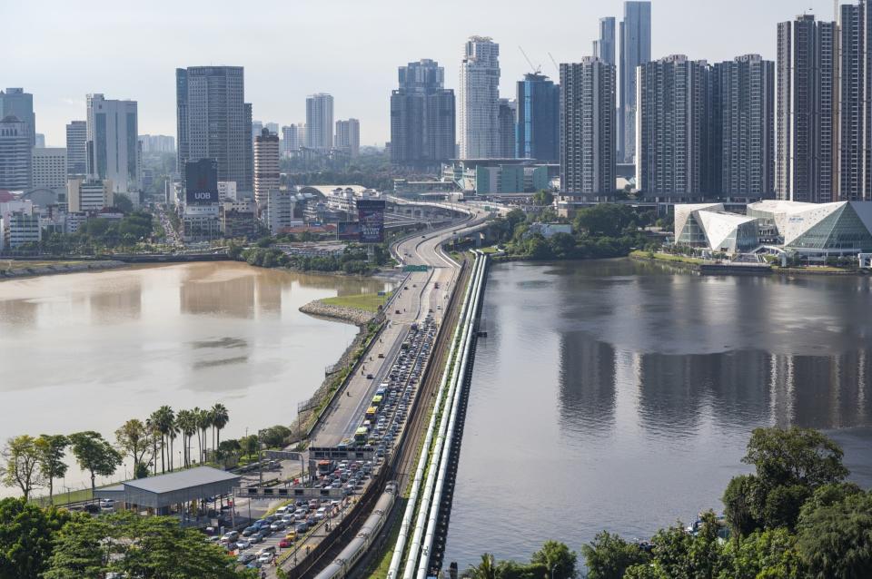 The traffic from Malaysia to Singapore on the Johor Singapore Causeway seen from Singapore in the evening, on Sunday, Aug. 14, 2022. 