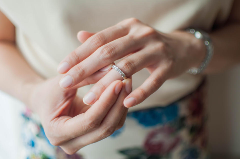 Woman touching her engagement ring