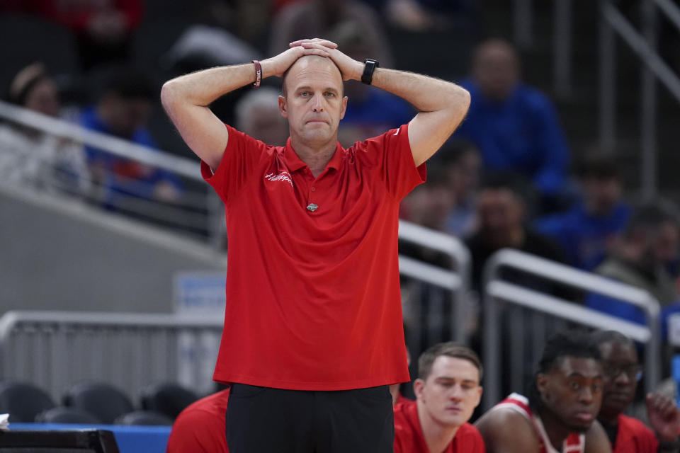 Western Kentucky head coach Steve Lutz watches from the bench in the second half of a first-round college basketball game against Marquette in the NCAA Tournament Friday, March 22, 2024, in Indianapolis, Ind. (AP Photo/Michael Conroy)