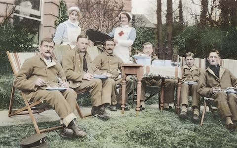 Hospital patients with nurse and VAD - Credit: Reproduced with the permission of the British Red Cross Museum and Archives