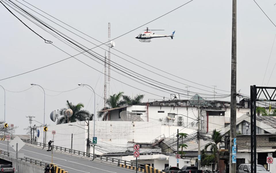 An Ecuadorean police helicopter flies over the TC television studio (AFP via Getty Images)