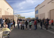 Democratic caucus-goers wait more than an hour in line in an early caucus ballot precinct site at an AFL-CIO union office in Henderson, Nev., Saturday, Feb. 15, 2020. Voters filled out ballots with first, second and third choice picks, to be tallied Saturday, Feb. 22, in the Nevada Democratic Party caucus. (AP Photo by Ken Ritter)