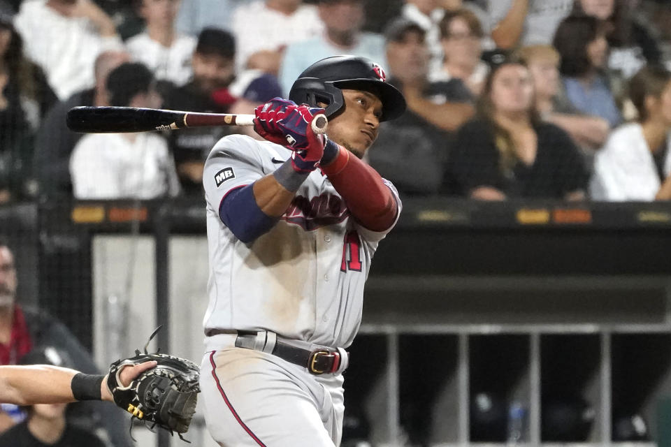 Minnesota Twins' Jorge Polanco watches his three-run home run off Chicago White Sox relief pitcher Codi Heuer during the sixth inning of a baseball game Wednesday, July 21, 2021, in Chicago. (AP Photo/Charles Rex Arbogast)