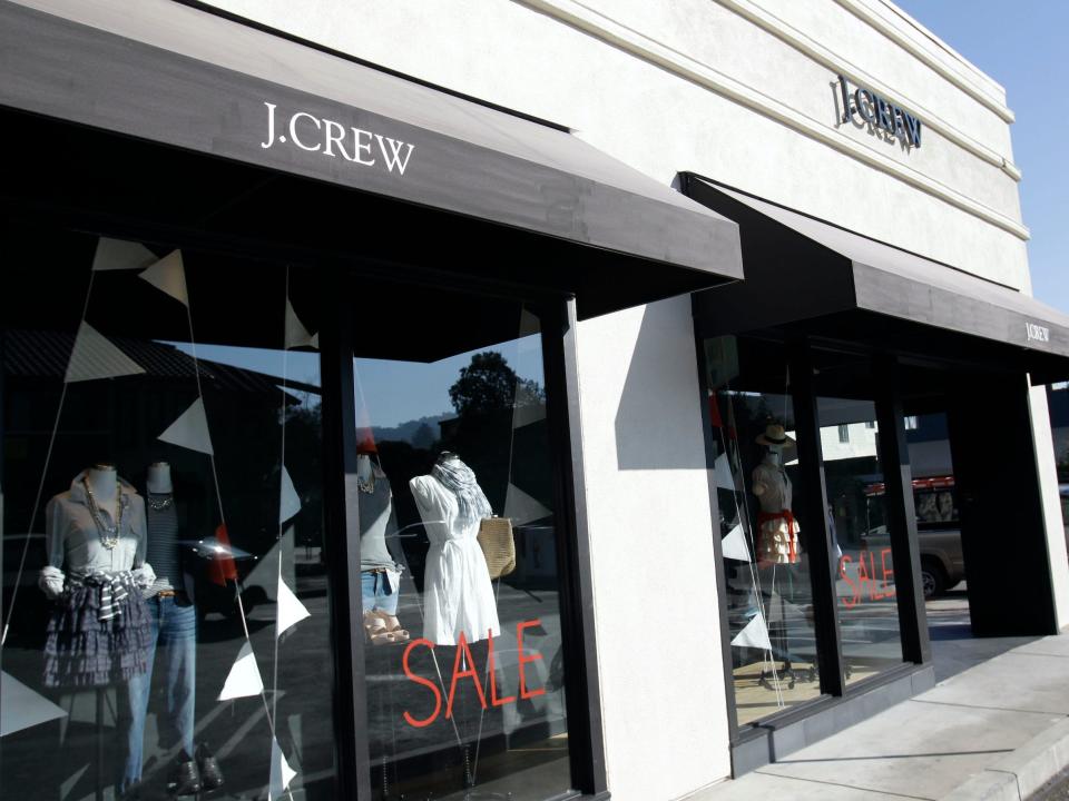 Exterior view of J. Crew store with mannequins in window