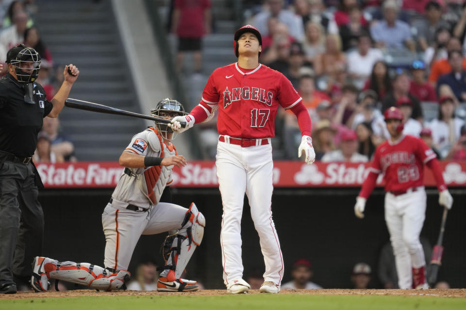 Los Angeles Angels designated hitter Shohei Ohtani (17) reacts after swinging a strike during the second inning of a baseball game against the San Francisco Giantsin Anaheim, Calif., Tuesday, Aug. 8, 2023. (AP Photo/Ashley Landis)