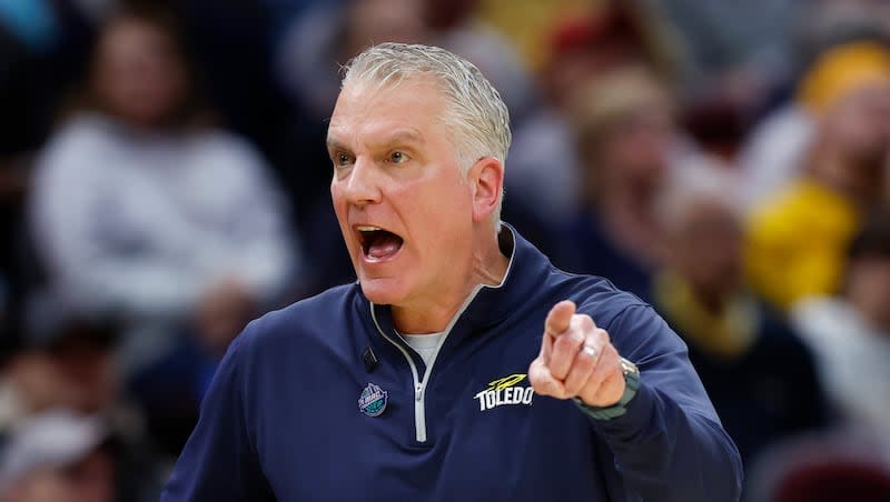 Toledo head coach Tod Kowalczyk argues a call during the first half of an NCAA college basketball game against Kent State for the championship of the Mid-American Conference Tournament, Saturday, March 11, 2023, in Cleveland. Kowalczyk is reportedly the front runner to land the open coaching job at Utah State.