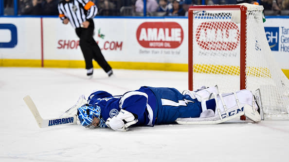 TAMPA, FL - DECEMBER 20: Tampa Bay Lightning goalie Ben Bishop (30) is injured after making a save during an NHL hockey game between the Detroit Red Wings and the Tampa Bay Lightning on December 20, 2016, at Amalie Arena in Tampa, FL. (Photo by Roy K. Miller/Icon Sportswire via Getty Images)