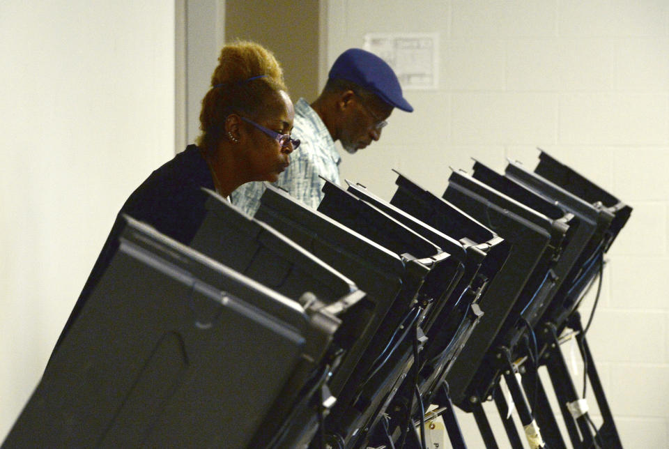 Tanya Archie-Younge, 56 and her husband, Jesse Younge, 62, cast their ballots at Precinct #25 at the West Charlotte Recreation Center Tuesday, September 10, 2019. Voters across Charlotte and the region went to the polls to vote in local Democrat and Republican primaries, while others, in the now infamous 9th District, voted to send either Dan McCready or Dan Bishop to represent them in Congress. (John D. Simmons/The Charlotte Observer via AP)