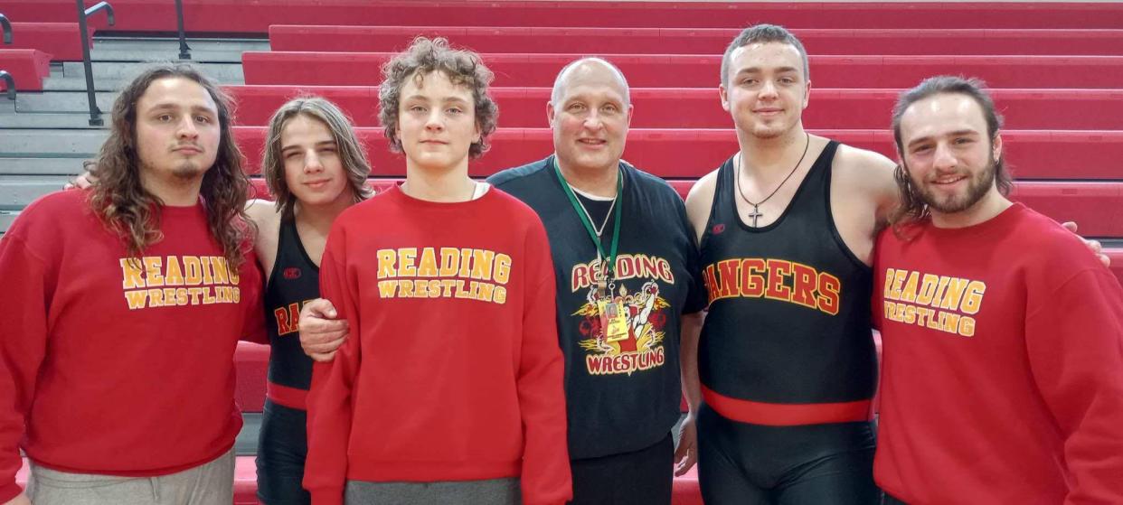 State qualifiers Lukas Strine and Eathan Westfall are a part of a legacy of Rangers who represent the success of the past, present and future of Reading wrestling. Pictured (from left to right): Elijah Strine, Lukas Strine, Isaac Westfall, head coach Mark Draper, Eathan Westfall and Noah Strine. Not Pictured: Senior state qualifier Hunter Dewey.