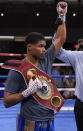 Shakur Stevenson holds up the belt after defeating Jeremiah Nakathila in a WBO interim junior lightweight title fight Saturday, June 12, 2021, in Las Vegas. (AP Photo/John Locher)